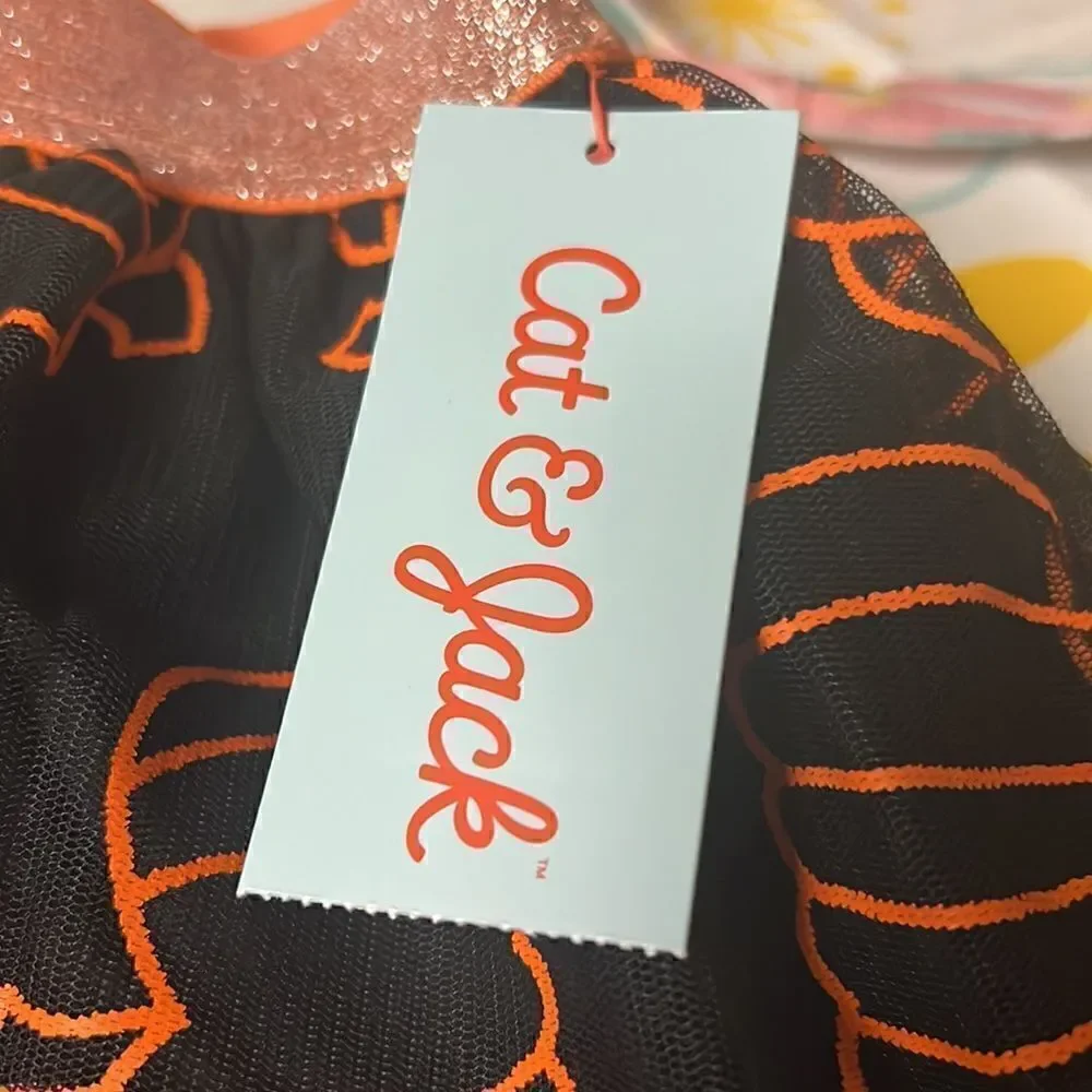 Black tutu orange pumpkins adorn this adorable fall Cat & Jack skirt